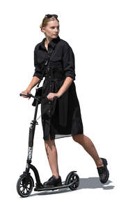 cut out woman in a black dress riding a scooter