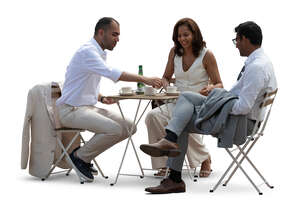 three friends sitting in a restaurant and talking