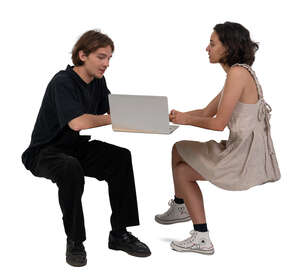 man and woman with computer discussing smth