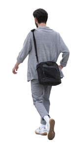 man wearing a grey cardigan walking