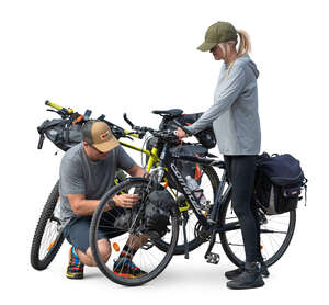 man helping to fix bags on the travel bikes