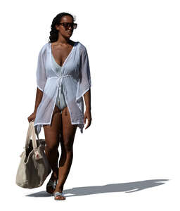 woman wearing a beach kaftan walking