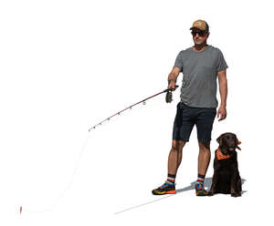 man with a dog fishing