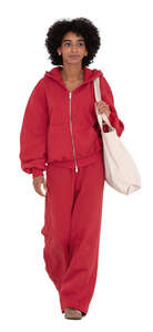 woman in red joggers and hoodie walking