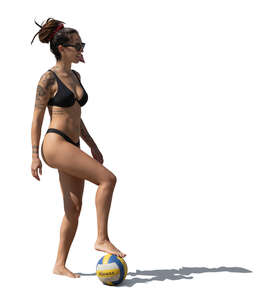 woman in a bathing suit standing with a ball