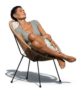 woman relaxing outside in a patio chair