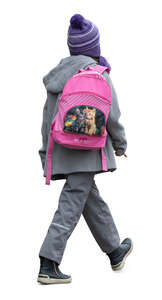 little girl with a school bag walking in autumn