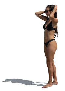 woman in a black bikini standing