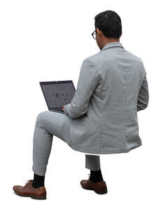 indian businessman sitting and working with computer