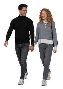 man and woman walking hand in hand