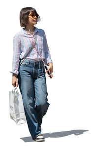 cut out woman with a small shopping bag walking