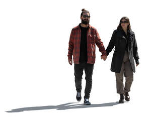 backlit south american couple walking