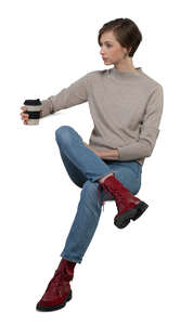 cut out woman sitting by the table and drinking coffee