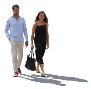 cut out backlit man and woman walking in summer