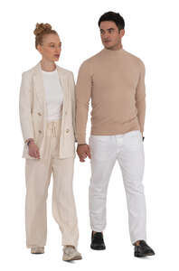 cut out couple in white clothing walking