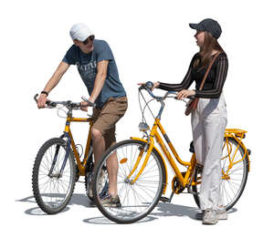 two young people with bikes standing and talking