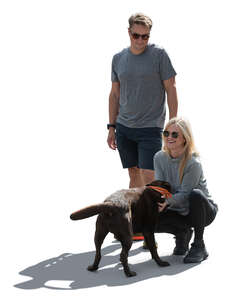 cut out backlit couple with a dog standing