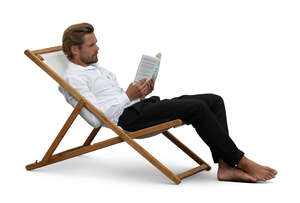 man sitting in a sling chair and reading a book