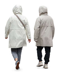 two people in light hooded rain coats walking