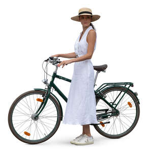 woman in a white dress standing with a bike