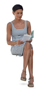 woman in a striped dress sitting and reading a book