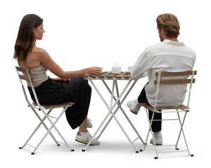 man and woman sitting in a cafe