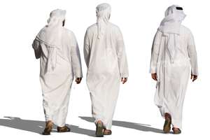 three arab men in white thobes walking