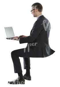 young businessman sitting and working with his laptop