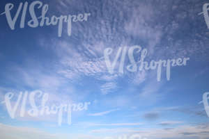 blue daytime sky with some cirrus clouds