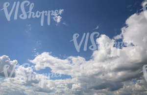 blue sky with white fluffy clouds