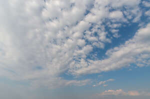 sky mostly covered with white clouds