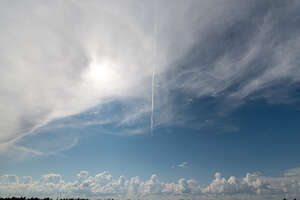 daytime sky with large white cloud