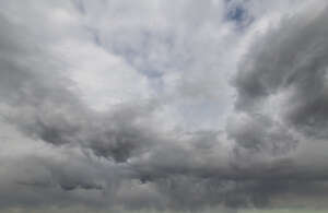 sky covered with fluffy grey clouds