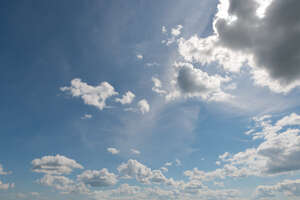 daytime sky with backlit white clouds