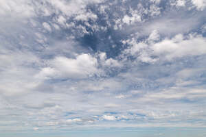 sky covered with thin white clouds