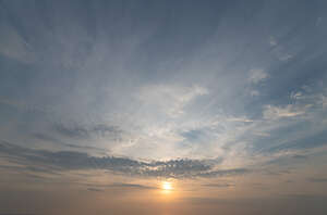 sky with thin clouds and sun setting