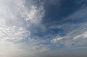 deep blue sky with thin clouds