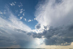 evening sky with large white clouds