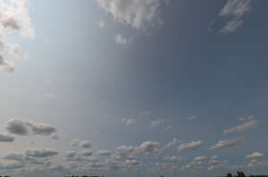 pale blue sky with small clouds