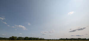 pale blue sky with little clouds