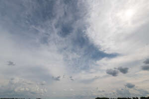 sky covered with thin clouds