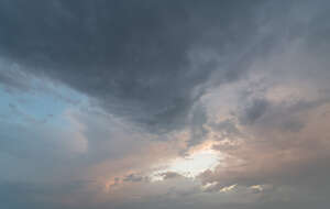 evening sky with sun behind the cloud