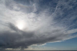 sky with sun partly visible behind the cloud