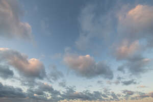 afternoon sky with light pink clouds