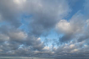 sky filled with grey cumulus clouds