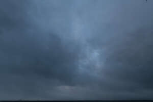 sky covered with dark blue clouds