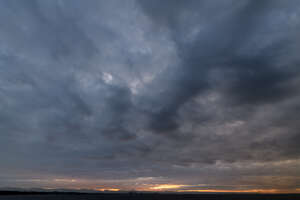 dramatic sunset with dark clouds