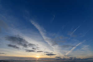 late evening sky with sun low in the sky