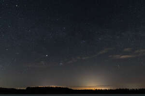 night sky with stars and thin clouds