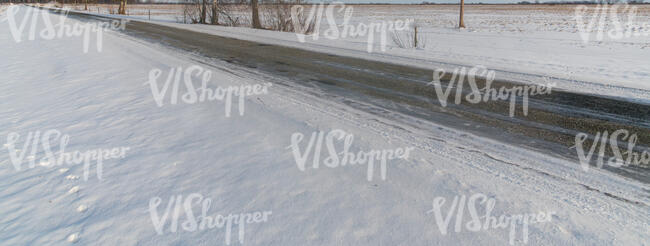 road in winter in snowy countryside